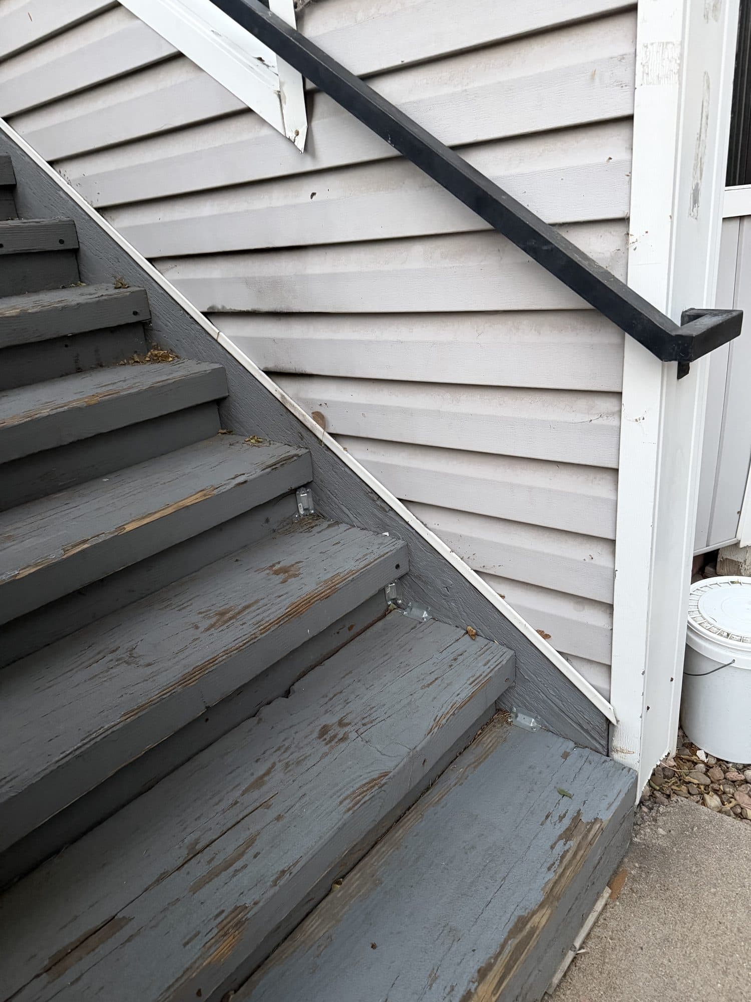 Weathered wood stairway — IMG_1067: Exterior wood stairway with graying, weathered treads and stringers.